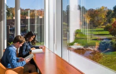 photo of students studying in sunshine and enjoying a lovely view