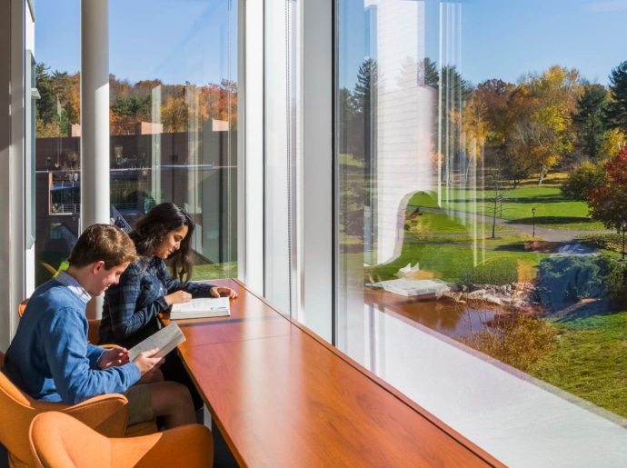 photo of students studying in sunshine and enjoying a lovely view