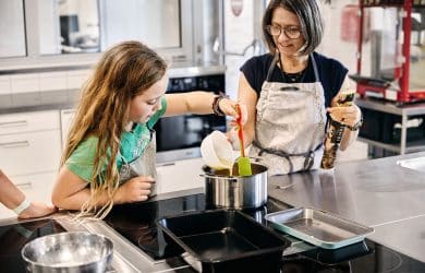 photo of teacher and student cooking