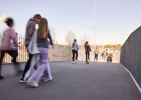 photo of students crossing a bridge on the CIS campus