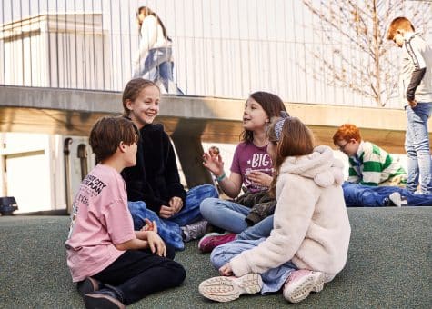 photo of students playing and talking in the CIS campus