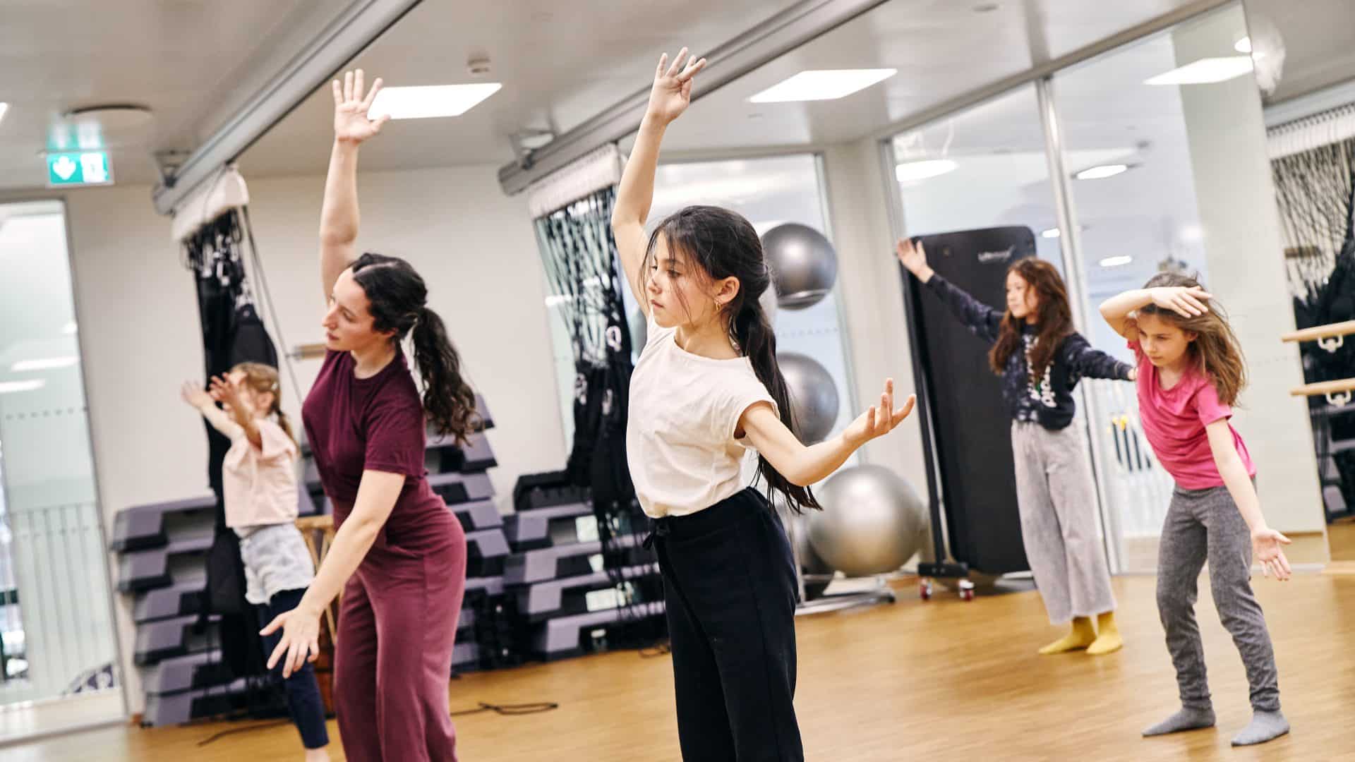 photo of students learning dance