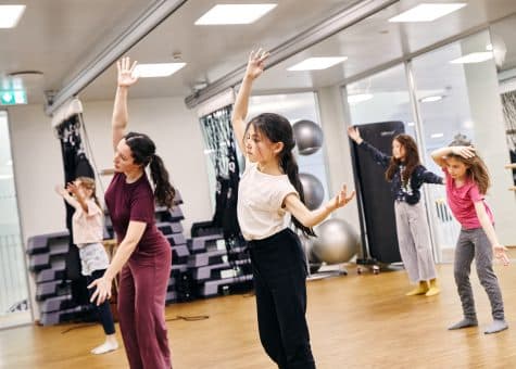 photo of students learning dance