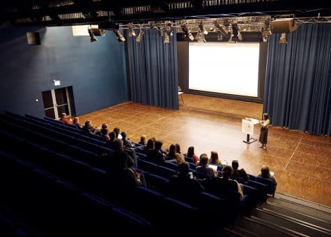 photo of a presentation in the theatre