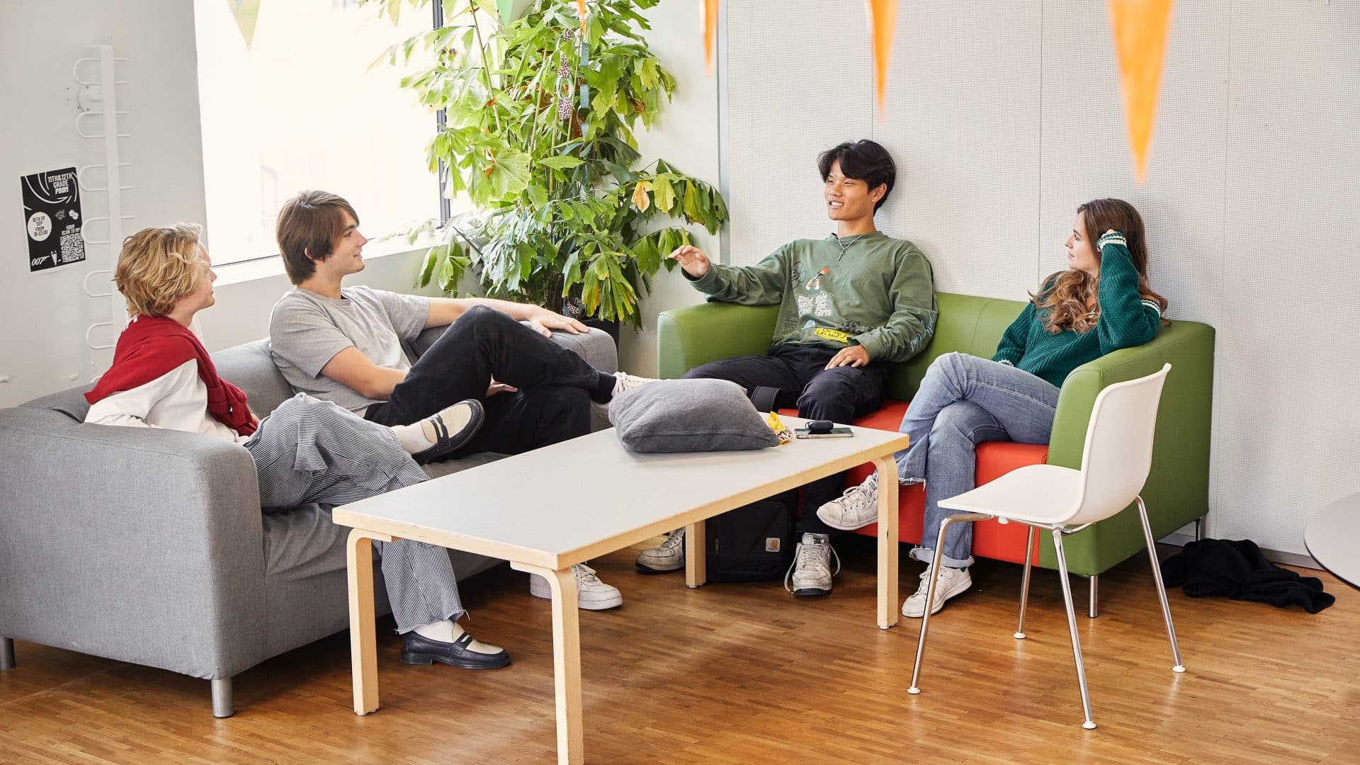 CIS students sitting on sofas having a discussion